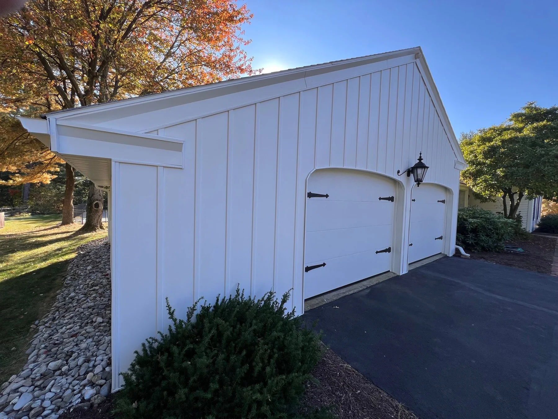 White exterior outbuilding painted by Premier Painting Solutions